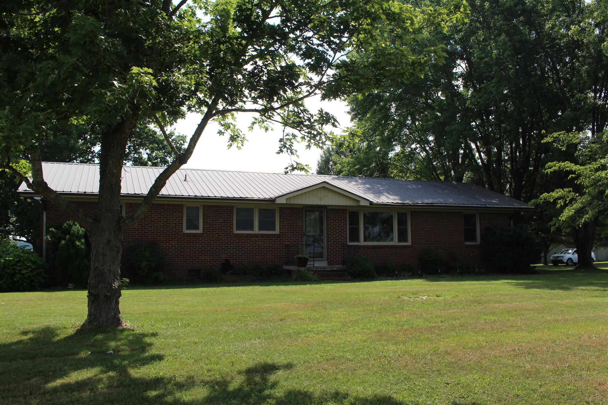 6740 Summitville Road Morrison, TN 37357 - Photo 1 of 30 a front view of house with yard and trees