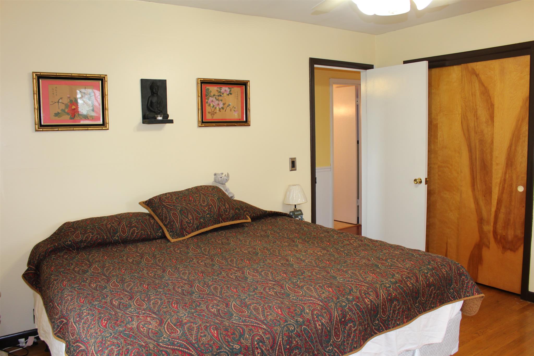 6740 Summitville Road Morrison, TN 37357 - Photo 14 of 30 a bedroom with a bed and wooden floor