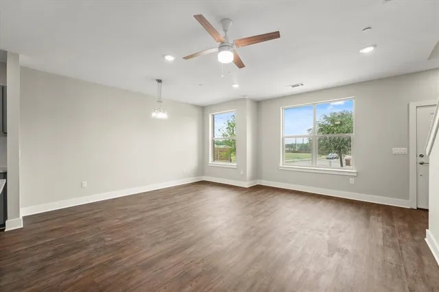 a view of kitchen with wooden floor electronic appliances and window