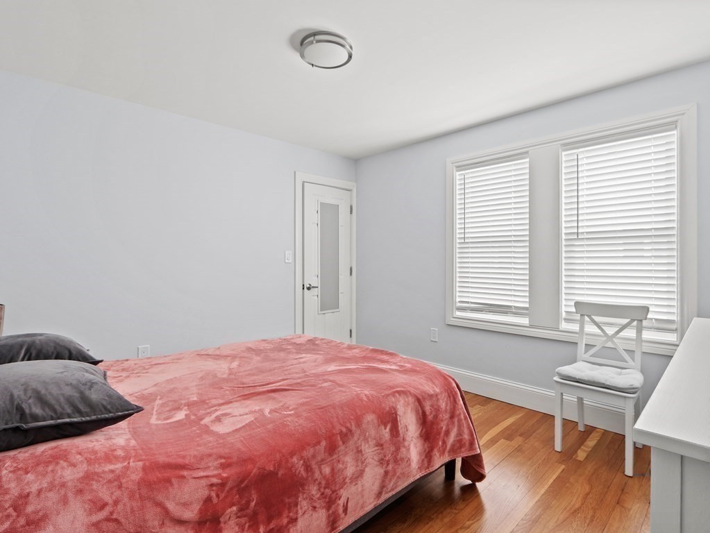 16-18 Kimball Road Watertown, MA 02472 - Photo 14 of 37 a bedroom with a bed and wooden floor