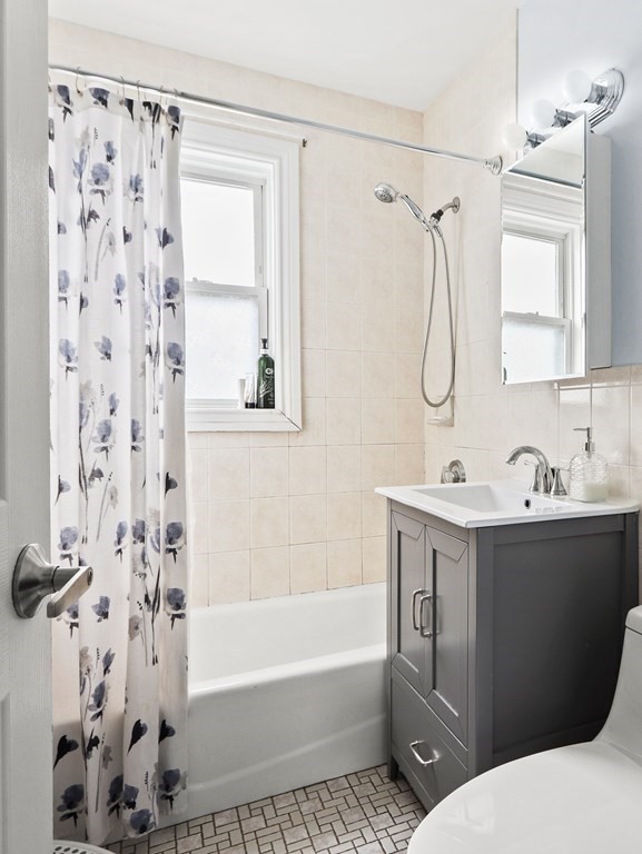 16-18 Kimball Road Watertown, MA 02472 - Photo 15 of 37 a bathroom with a sink toilet and shower
