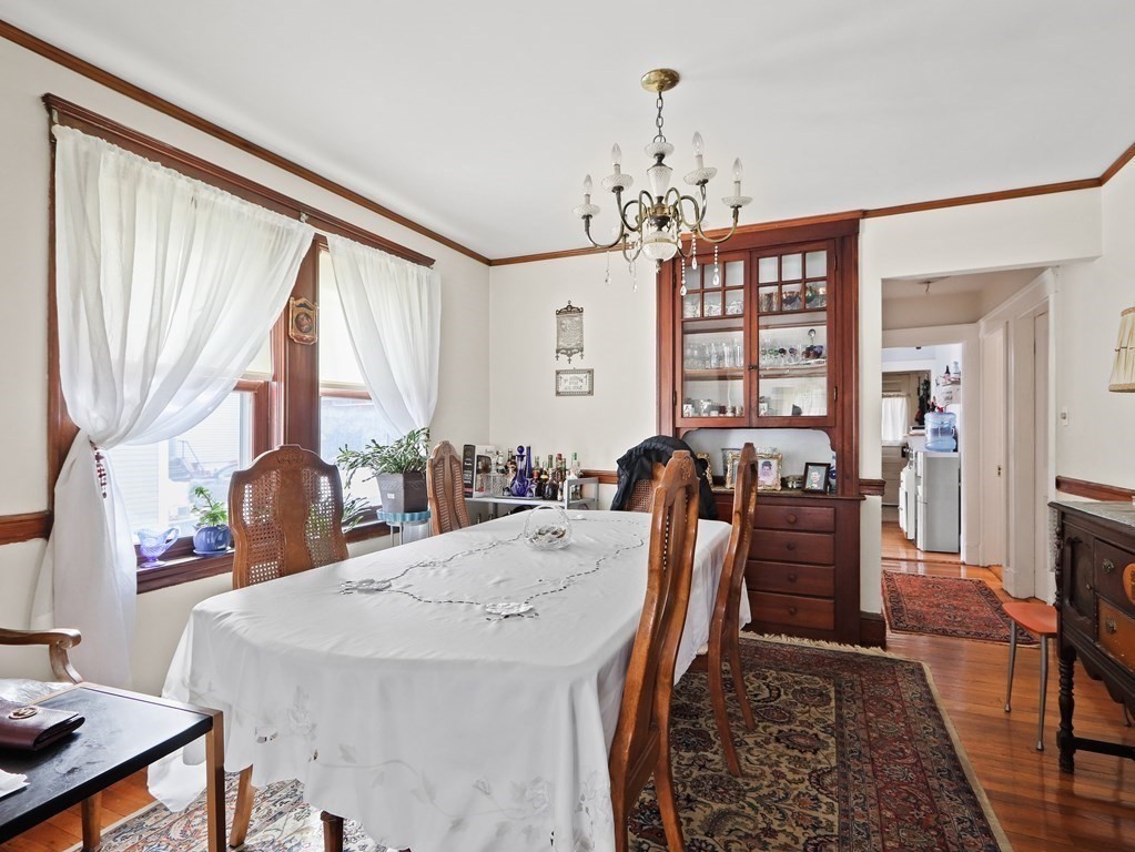 16-18 Kimball Road Watertown, MA 02472 - Photo 19 of 37 a view of a dining room with furniture and chandelier