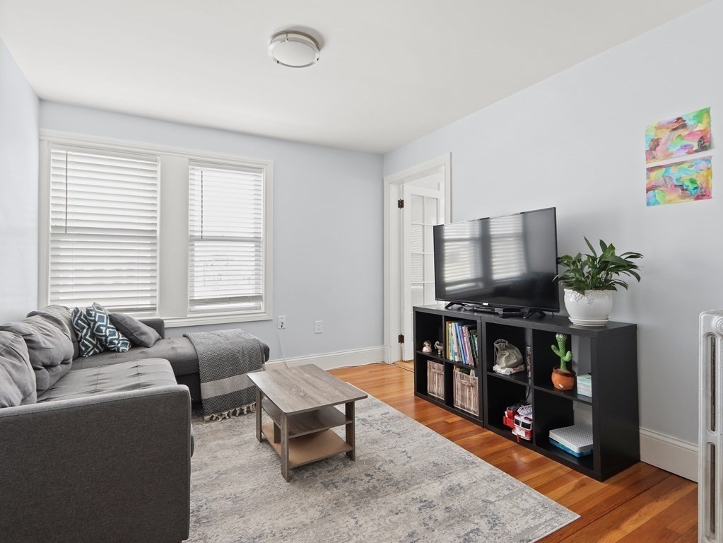 16-18 Kimball Road Watertown, MA 02472 - Photo 2 of 37 a living room with furniture and a flat screen tv