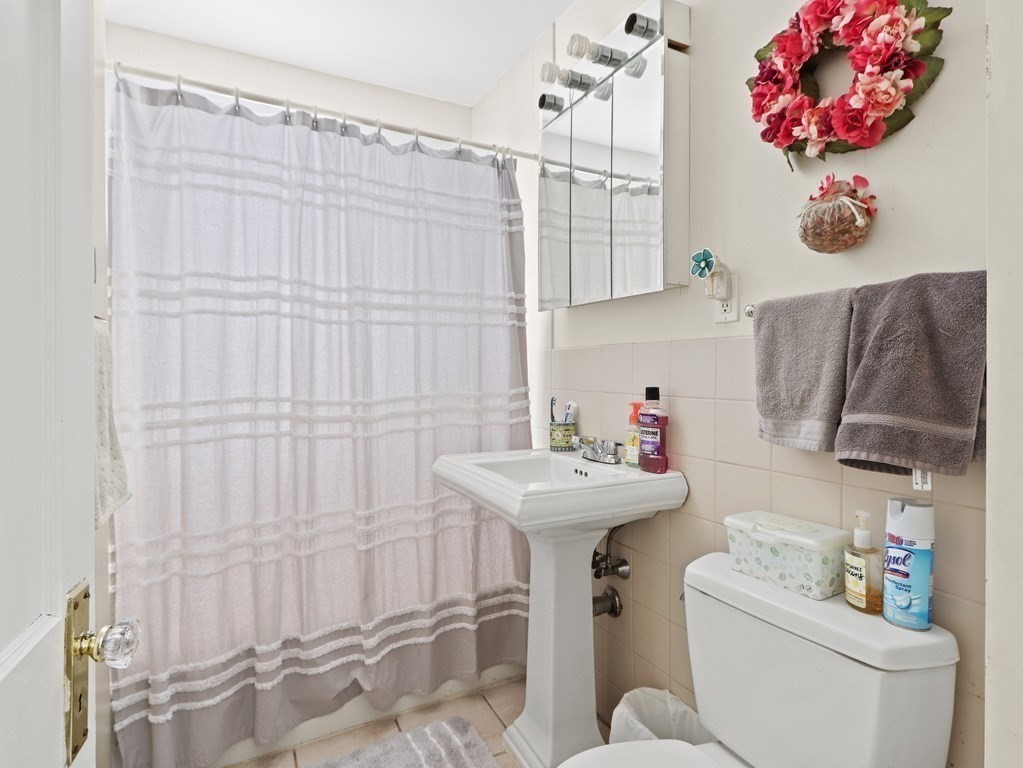 16-18 Kimball Road Watertown, MA 02472 - Photo 24 of 37 a bathroom with a sink toilet and shower