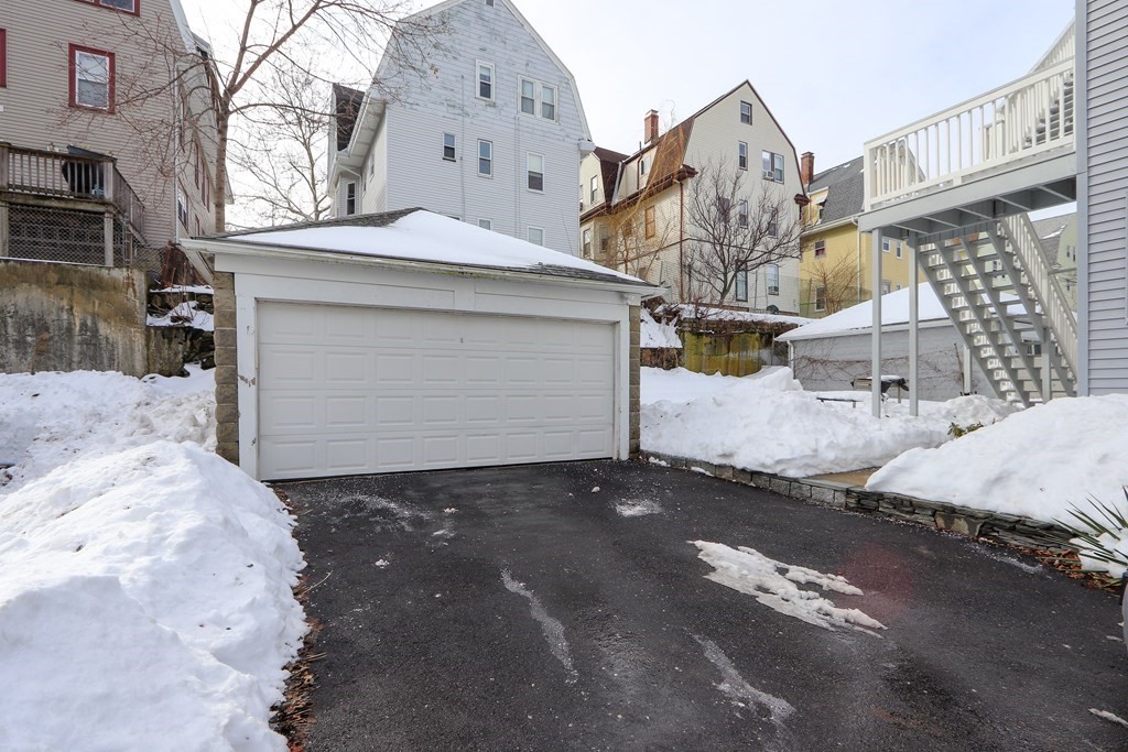 16-18 Kimball Road Watertown, MA 02472 - Photo 25 of 37 a view of a house with a snow in the background