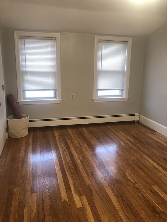 16-18 Kimball Road Watertown, MA 02472 - Photo 37 of 37 a view of an empty room with wooden floor and a window