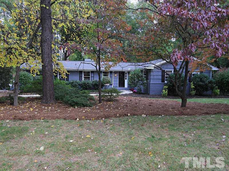 1009 Paddock Drive Raleigh, NC 27609 - Photo 1 of 18 a front view of a house with a tree s
