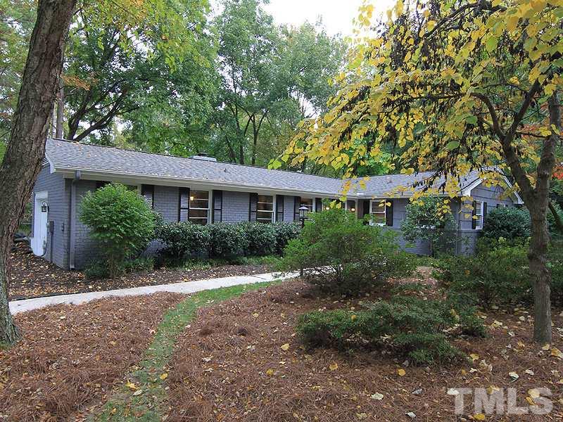1009 Paddock Drive Raleigh, NC 27609 - Photo 2 of 18 a view of a house with a tree
