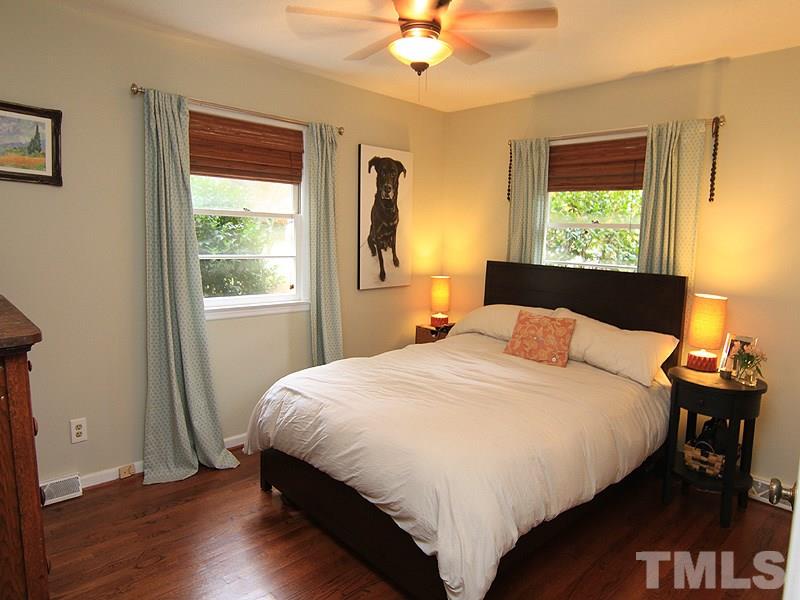 1009 Paddock Drive Raleigh, NC 27609 - Photo 13 of 18 a bedroom with a bed and a window