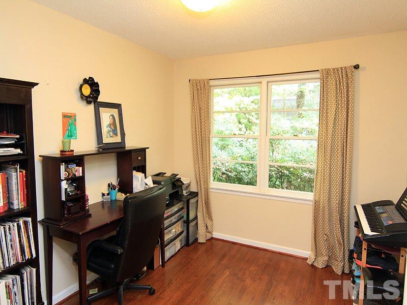 1009 Paddock Drive Raleigh, NC 27609 - Photo 16 of 18 a view of a workspace with furniture and a window