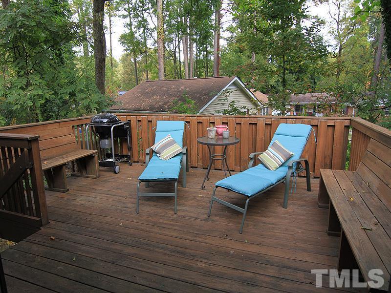 1009 Paddock Drive Raleigh, NC 27609 - Photo 17 of 18 an outdoor sitting area with furniture and wooden floor