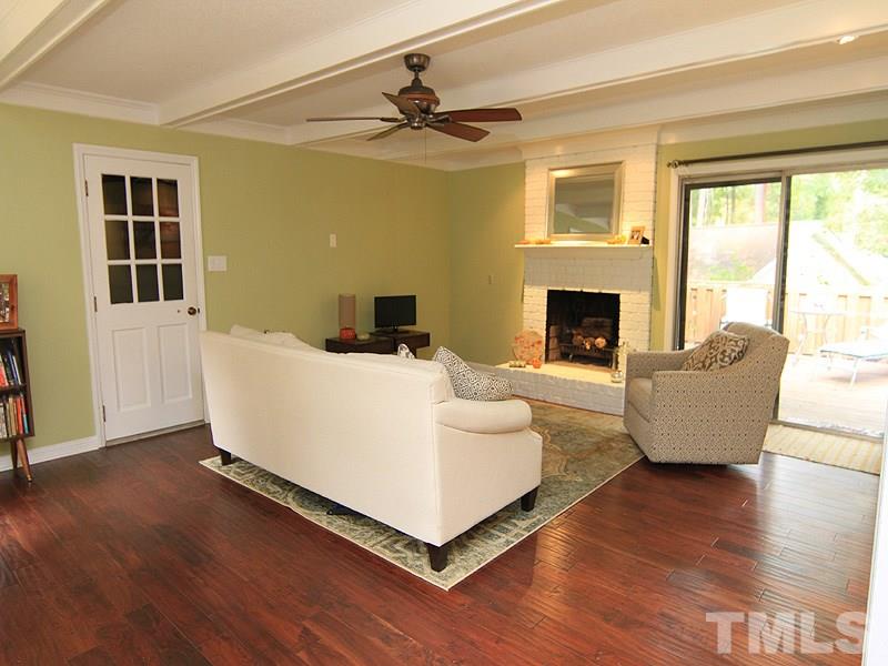 1009 Paddock Drive Raleigh, NC 27609 - Photo 3 of 18 a living room with furniture and a fireplace