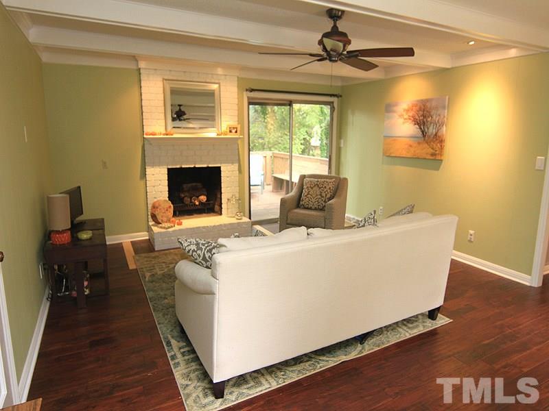 1009 Paddock Drive Raleigh, NC 27609 - Photo 4 of 18 a living room with furniture and a fireplace