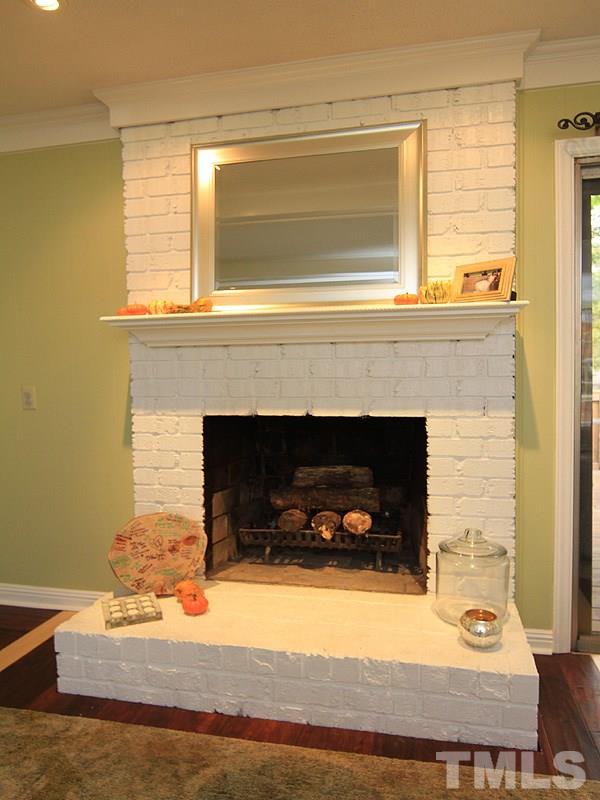 1009 Paddock Drive Raleigh, NC 27609 - Photo 5 of 18 a living room with furniture and a fireplace