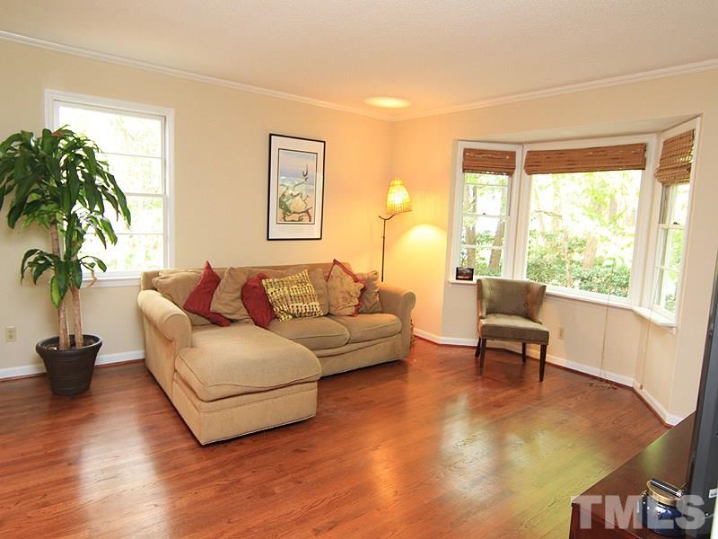 1009 Paddock Drive Raleigh, NC 27609 - Photo 10 of 18 a living room with furniture and a large window