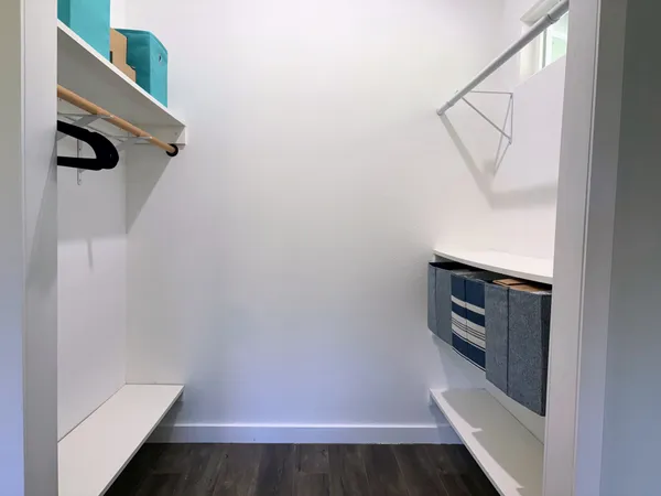 a bathroom with double sink and a mirror