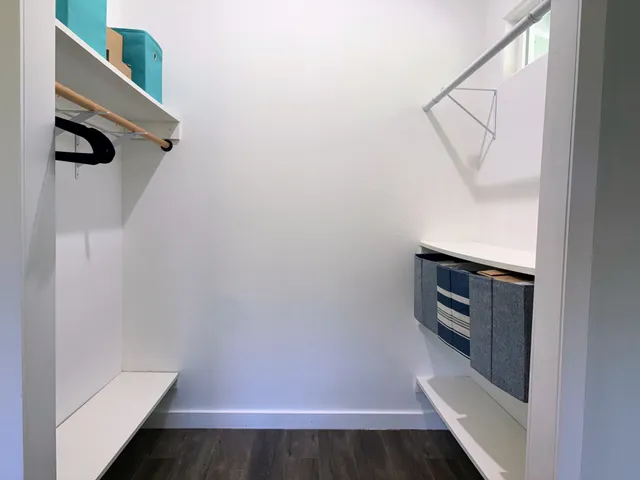 a bathroom with double sink and a mirror