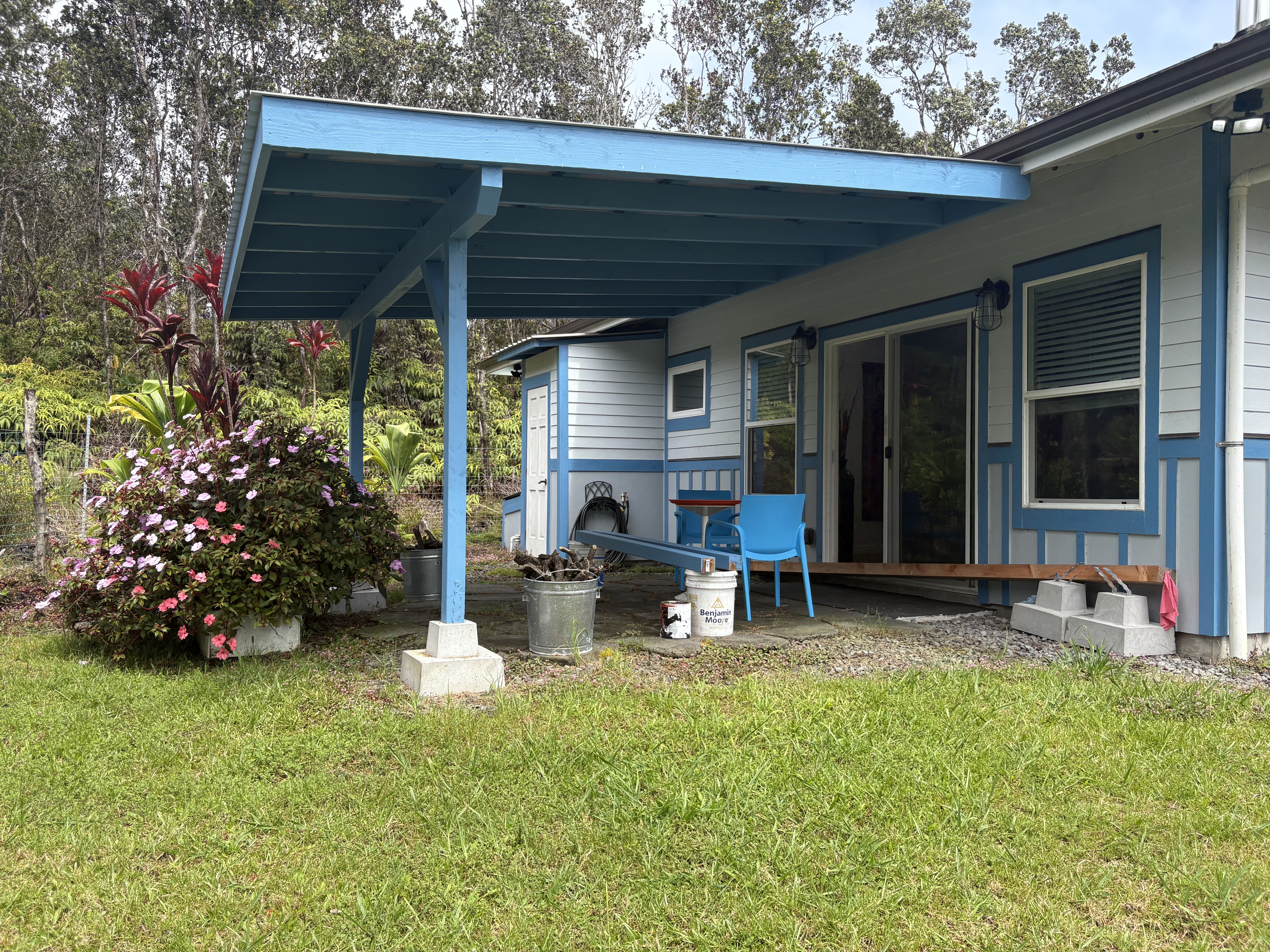 11-3927 Liona Street Volcano, HI 96785 - Photo 22 of 30 a front view of a house with garden and sitting area