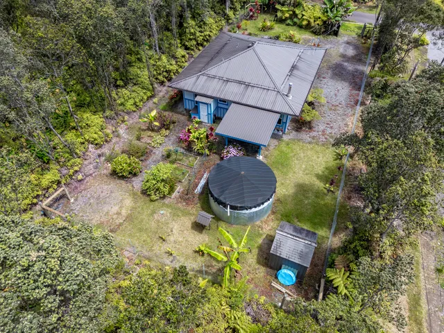 a front view of house with yard and outdoor seating