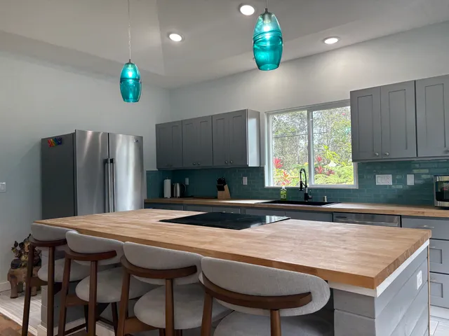 a kitchen with a table and chairs in it