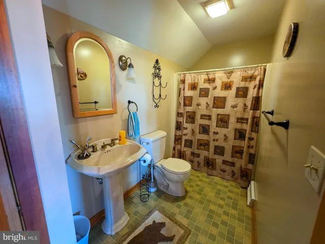 a view of a hallway view with wooden floor and furniture