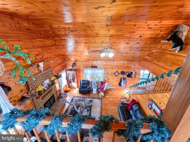 a view of a living room with floor to ceiling window