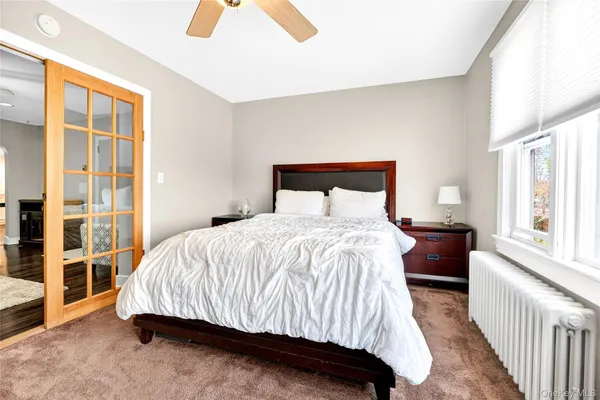 a room with a dresser and a mirror