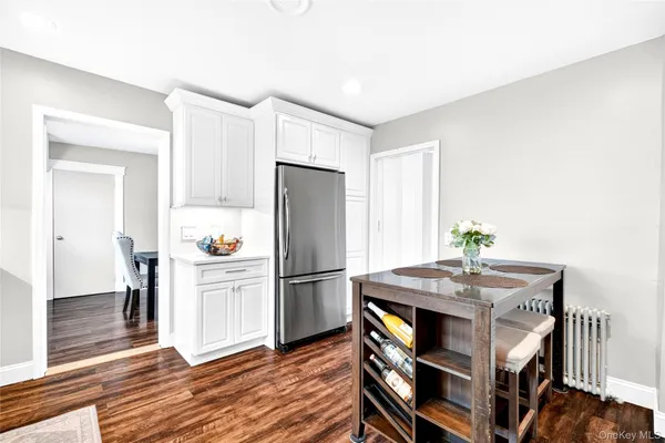 a kitchen with a refrigerator and cabinets