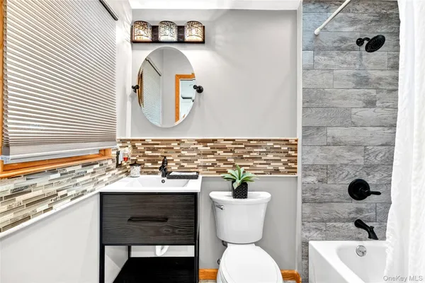 a bathroom with a sink a mirror and a window