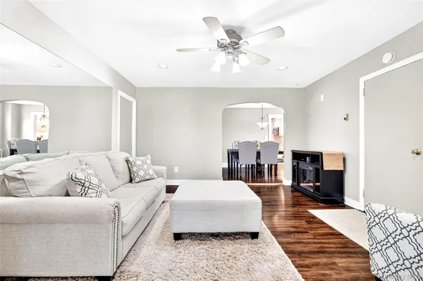 a spacious bedroom with a large bed and a couch