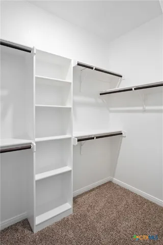 a bathroom with a granite countertop sink toilet mirror and bathtub