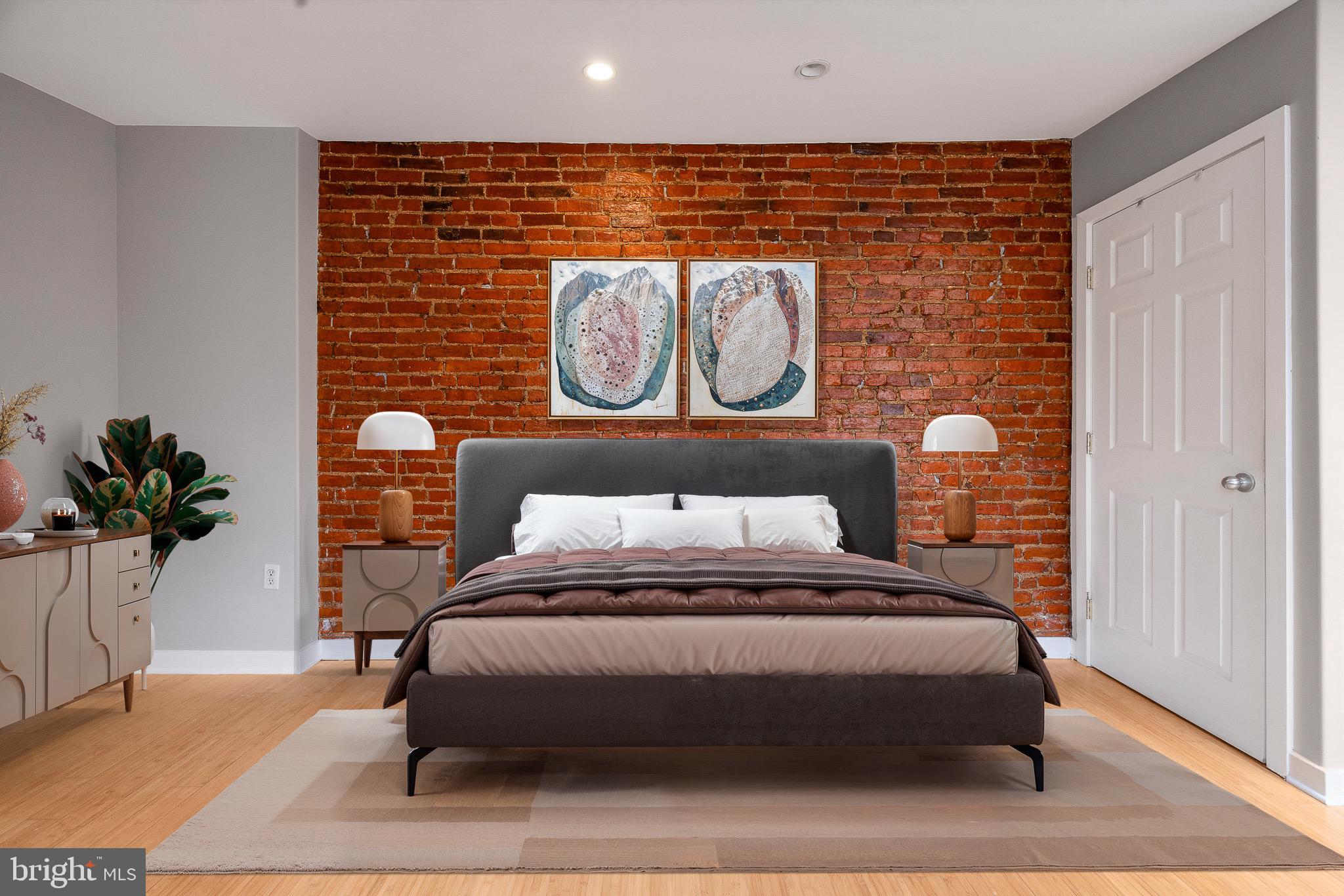 1516 Catharine Street, Unit 2 Philadelphia, PA 19146 - Photo 17 of 31 a bedroom with a bed and a potted plant