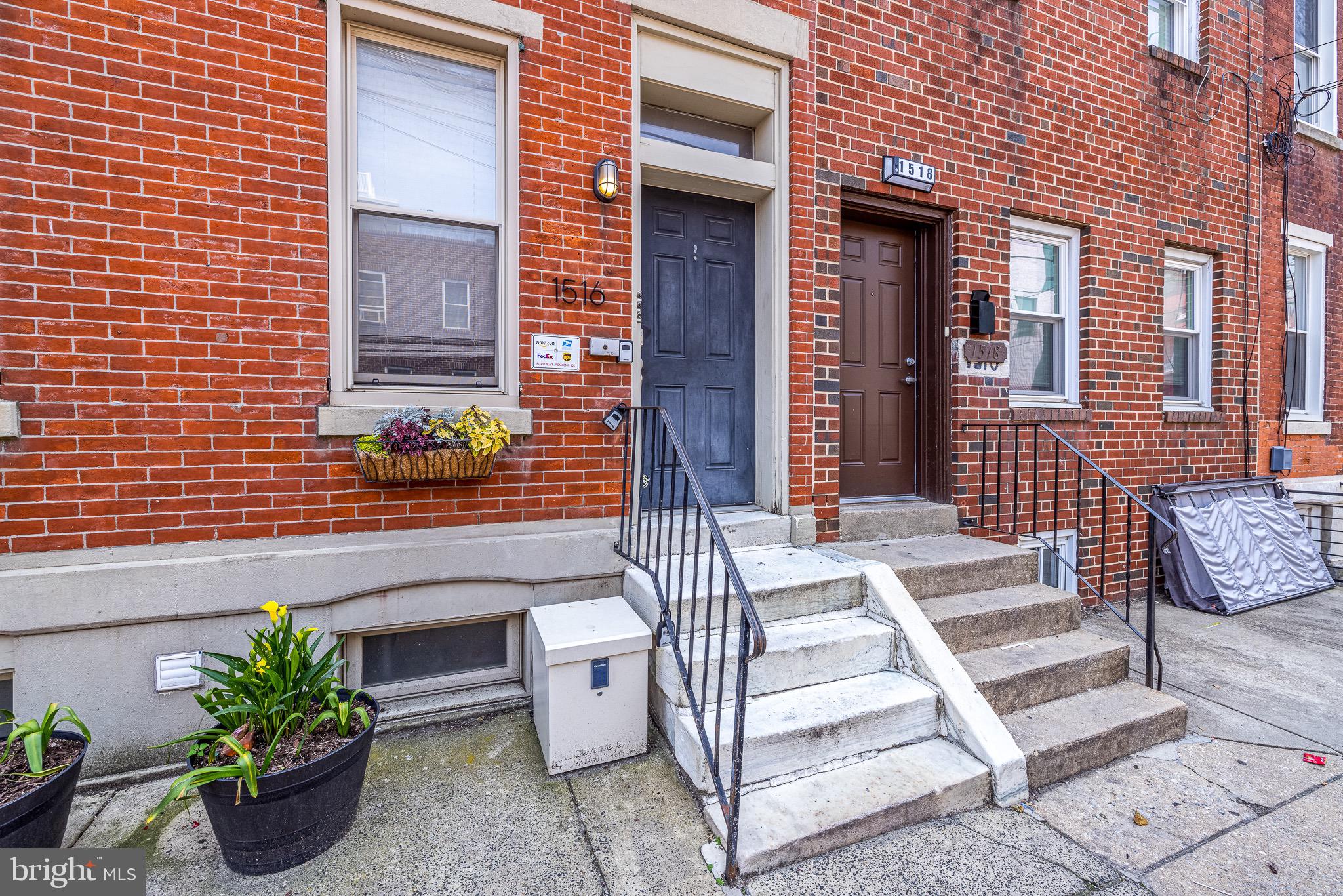 1516 Catharine Street, Unit 2 Philadelphia, PA 19146 - Photo 2 of 31 an outdoor view of a house with a potted plant