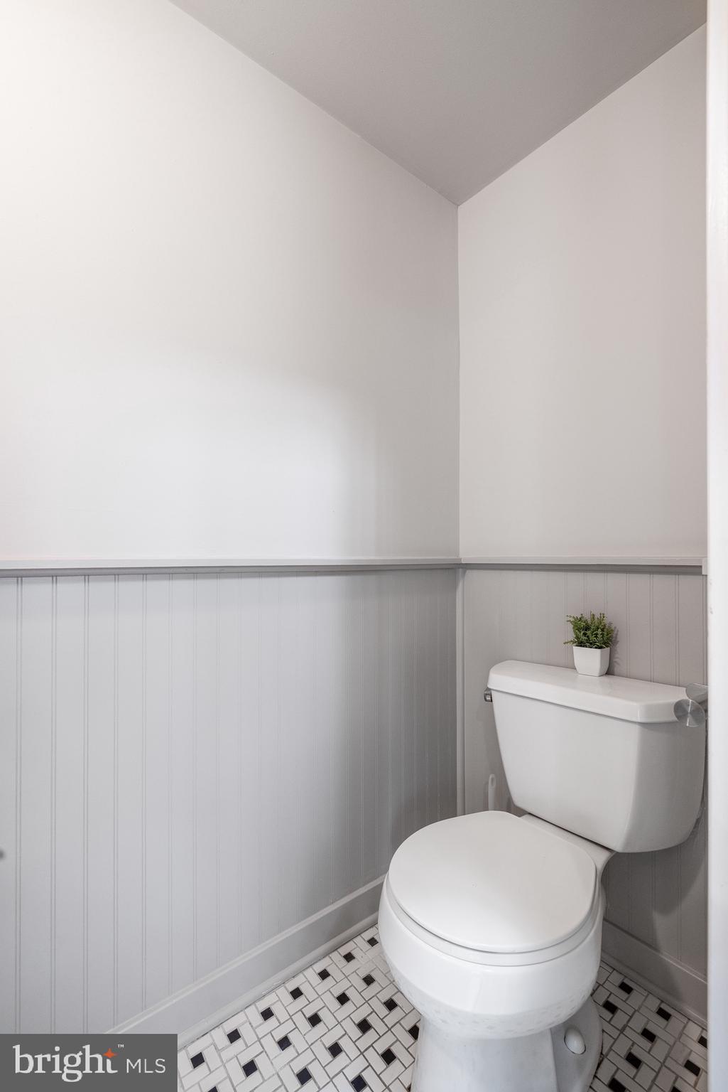 1516 Catharine Street, Unit 2 Philadelphia, PA 19146 - Photo 22 of 31 a white toilet sitting next to a bathroom sink