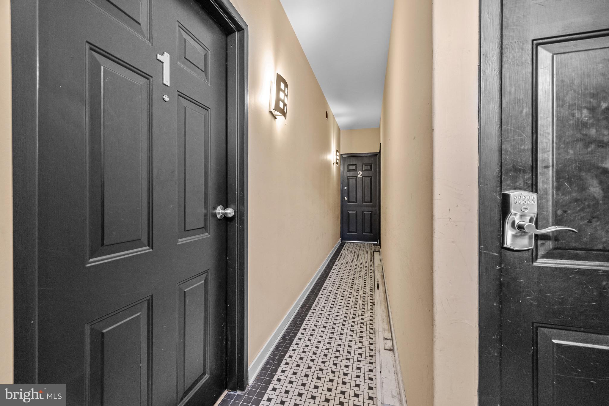 1516 Catharine Street, Unit 2 Philadelphia, PA 19146 - Photo 3 of 31 a view of a hallway with wooden floor and staircase