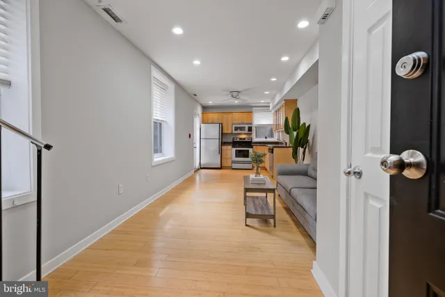 an entryway and livingroom with furniture