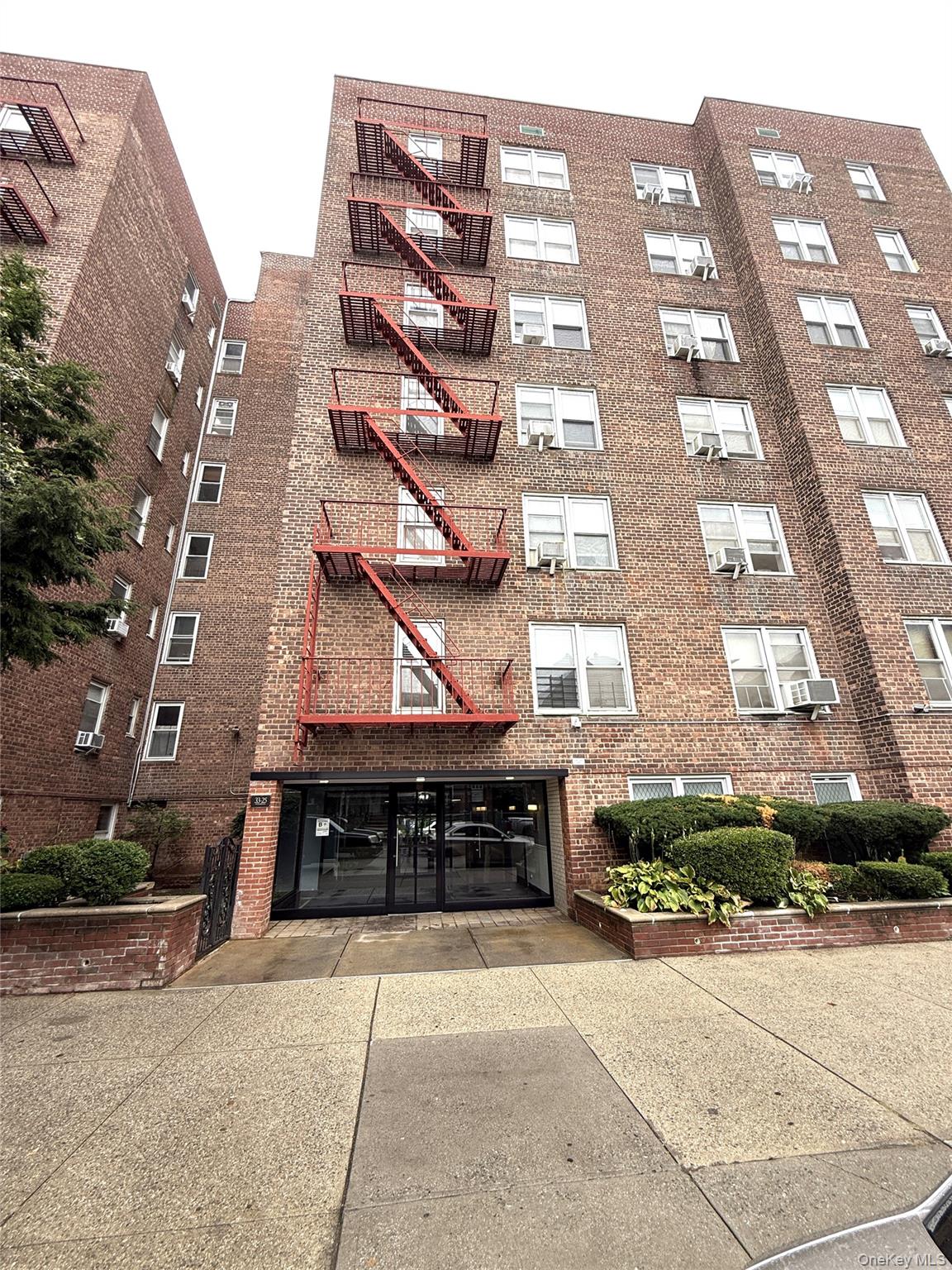 33-25 90th Street, Unit 5D Queens, NY 11372 - Photo 1 of 18 a large building with a street