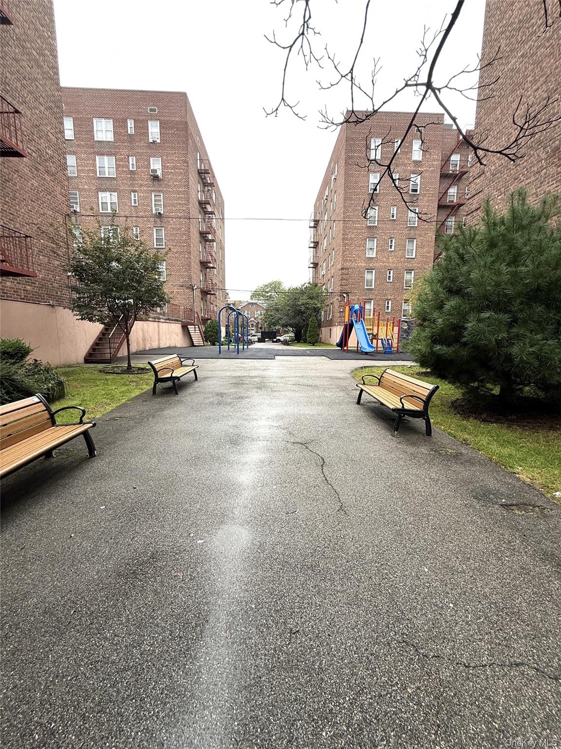 33-25 90th Street, Unit 5D Queens, NY 11372 - Photo 13 of 18 a view of a street with cars