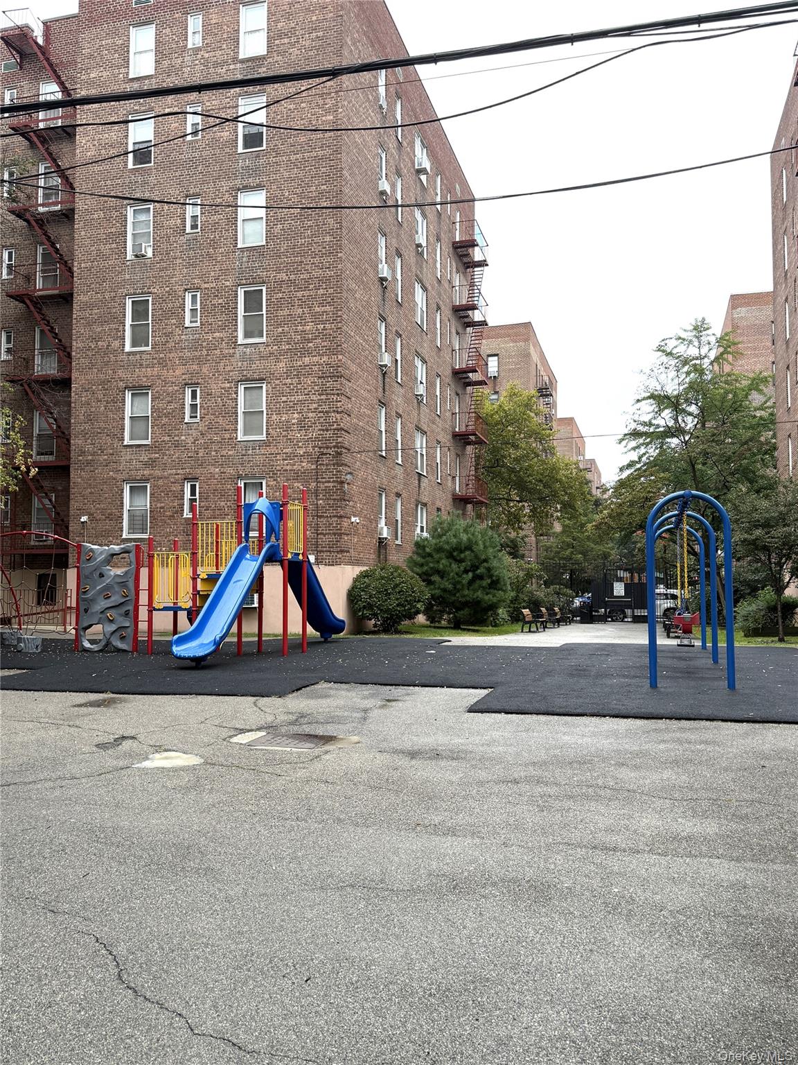 33-25 90th Street, Unit 5D Queens, NY 11372 - Photo 16 of 18 a view of a street with a cars
