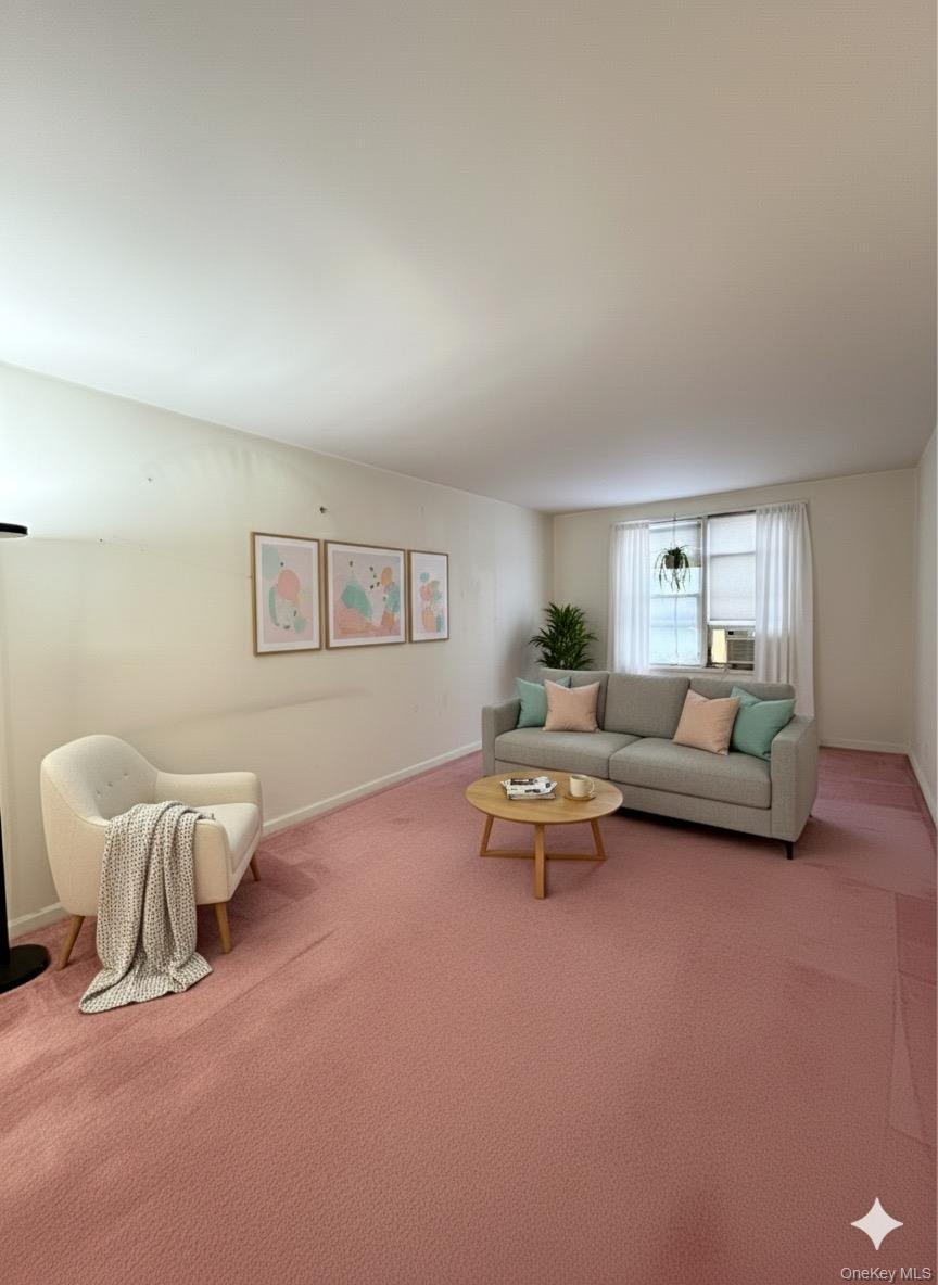 33-25 90th Street, Unit 5D Queens, NY 11372 - Photo 2 of 18 a living room with furniture and a window