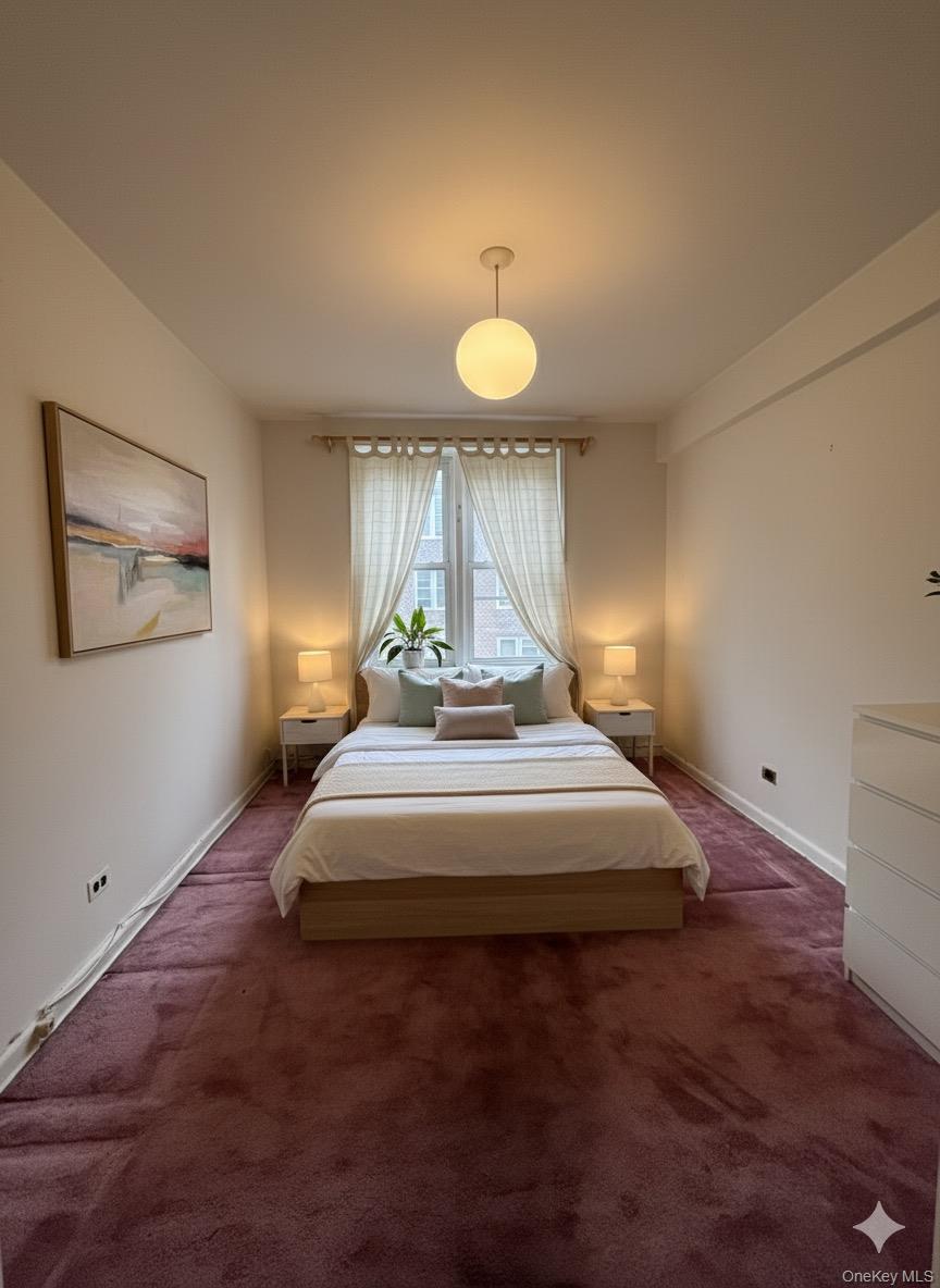 33-25 90th Street, Unit 5D Queens, NY 11372 - Photo 6 of 18 a spacious bedroom with a bed and a table