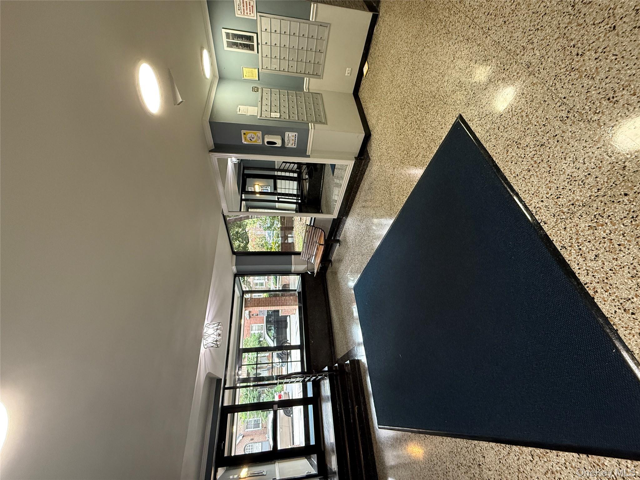 33-25 90th Street, Unit 5D Queens, NY 11372 - Photo 10 of 18 a living room with furniture and windows