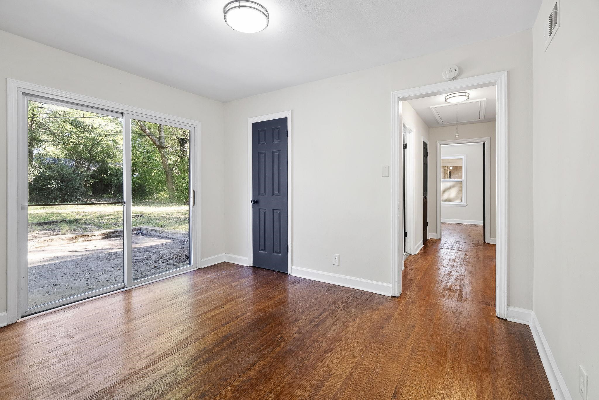1168 South Perkins Road Memphis, TN 38117 - Photo 14 of 34 wooden floor in an empty room with a window