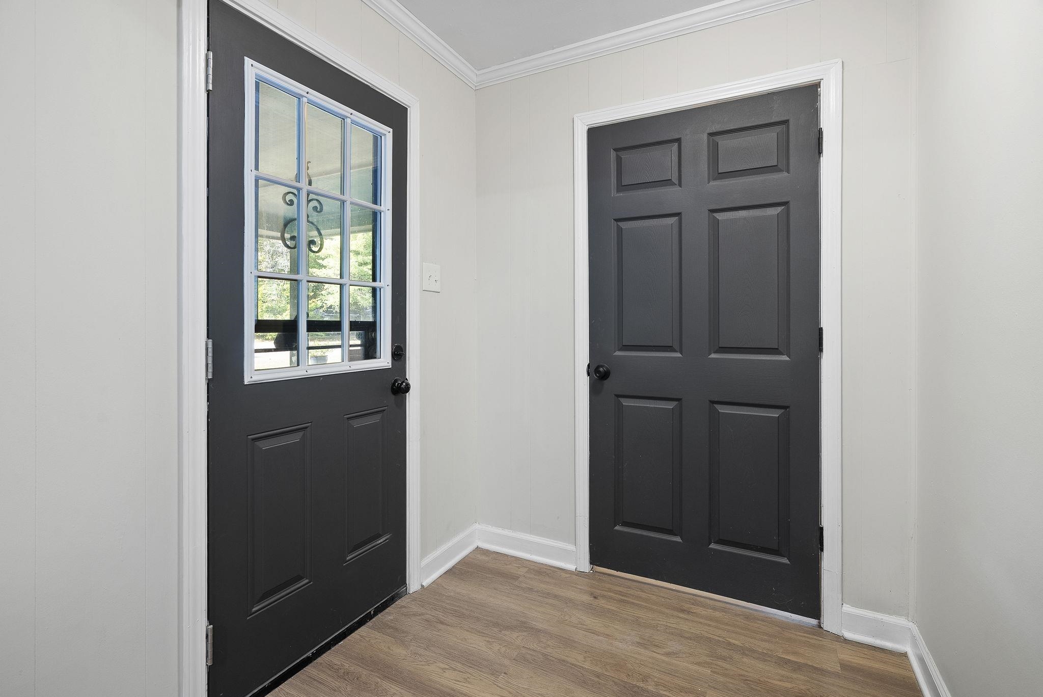 1168 South Perkins Road Memphis, TN 38117 - Photo 27 of 34 an empty room with wooden floor and closet