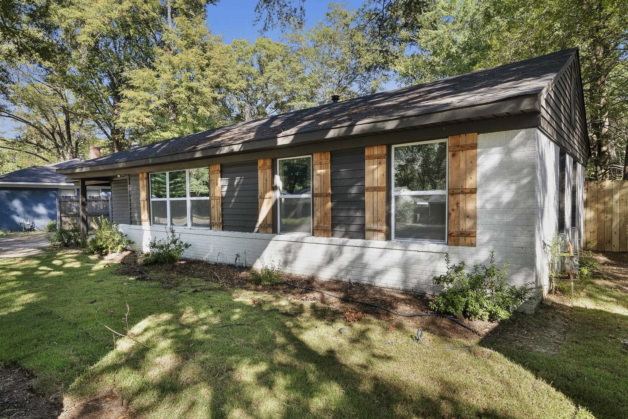 1168 South Perkins Road Memphis, TN 38117 - Photo 3 of 34 a backyard of a house with yard barbeque oven and outdoor seating