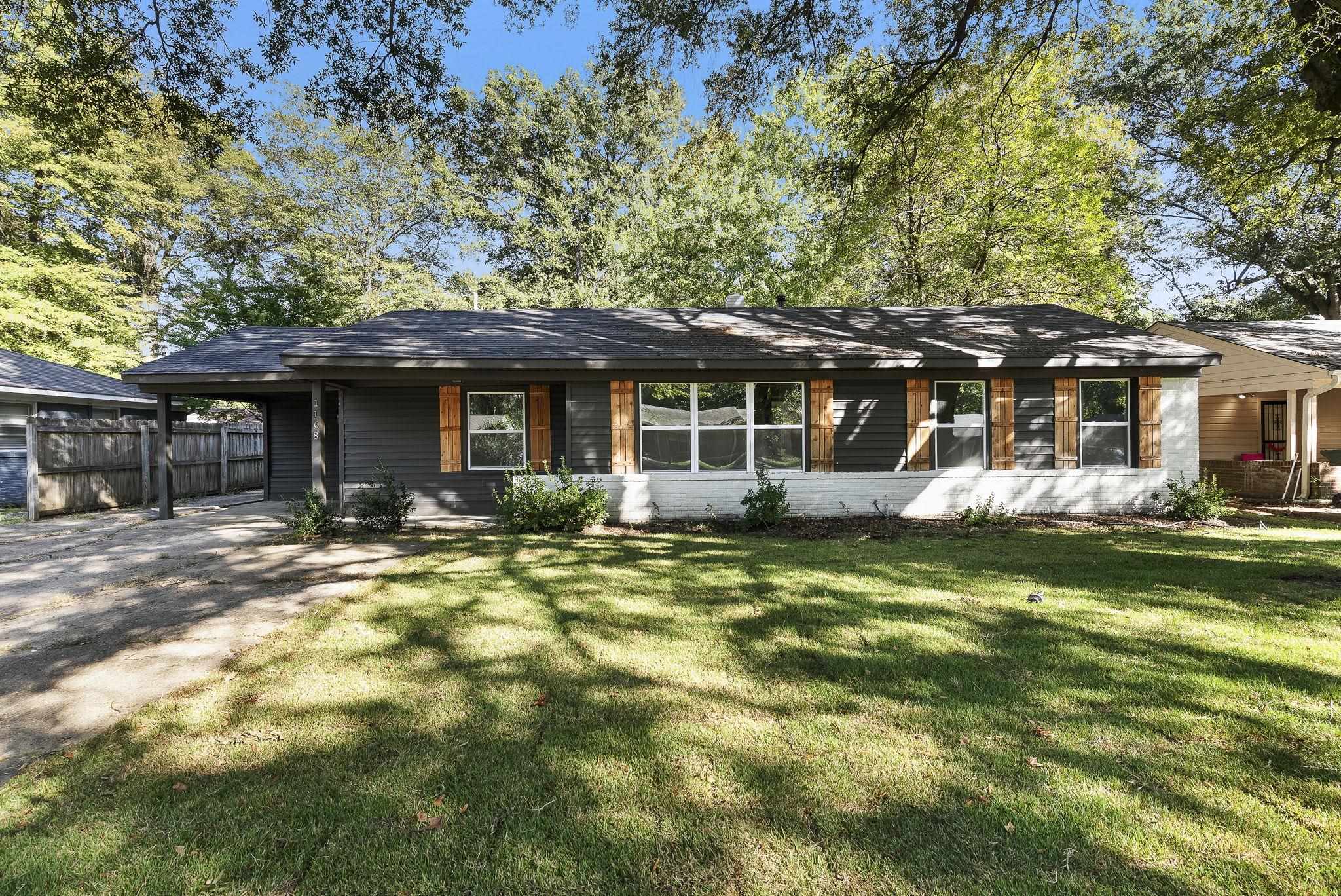 1168 South Perkins Road Memphis, TN 38117 - Photo 32 of 34 a front view of a house with a garden