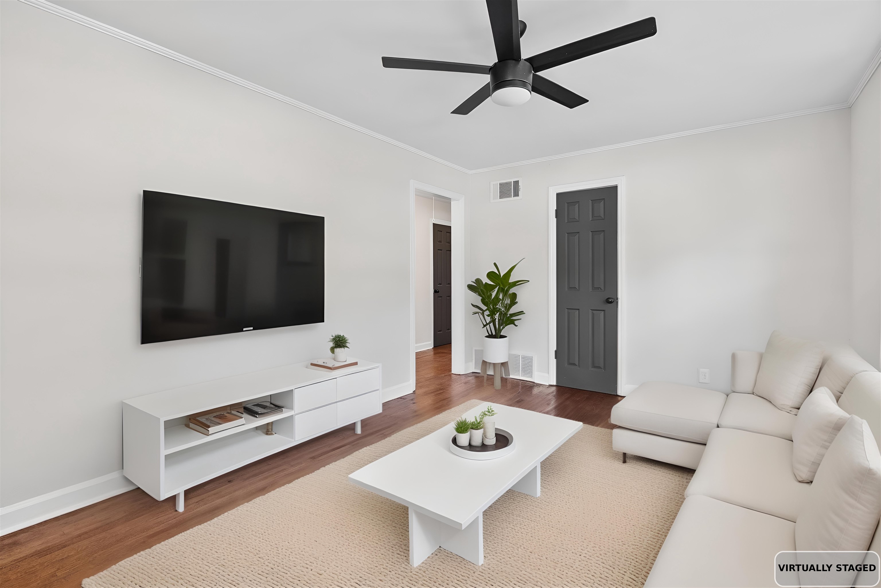 1168 South Perkins Road Memphis, TN 38117 - Photo 5 of 34 a living room with furniture and a flat screen tv