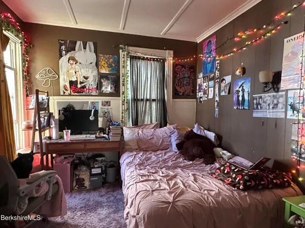 a bed room with a bed and a desk