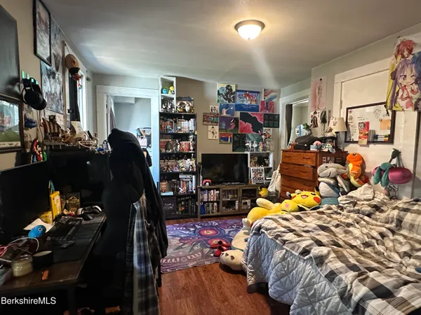 a view of a kitchen with fridge and workspace