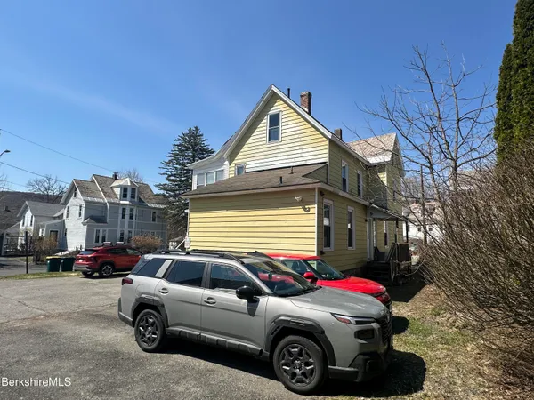 a car parked in front of a house